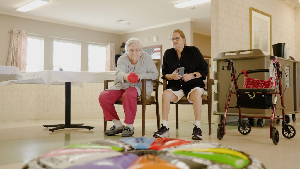 A woman in memory care doing a therapy session