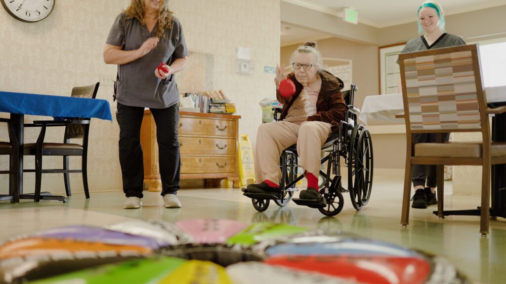 A woman in memory care doing a therapy session